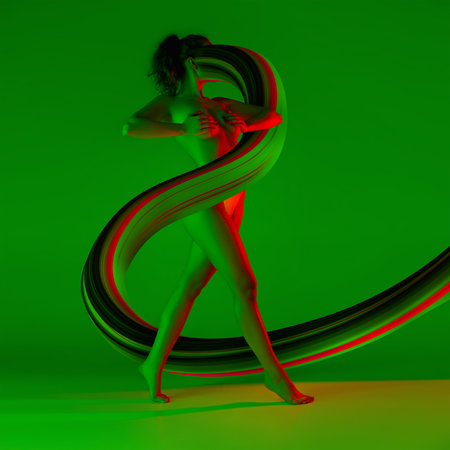 Fit sportive woman with long fluid flood on gradient background. Negative space to insert your text. Modern design. Contemporary colorful and conceptual bright art collage.の写真素材