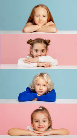 Four happy little kids boys and girls looking at camera isolated over bicolored studio background. Creative collageの写真素材