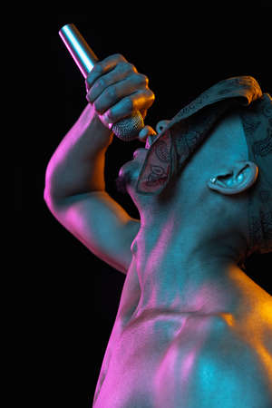 African-american young mans portrait on black studio background in neon. Concept of fashion, mans...