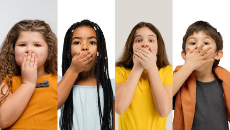 Art collage made of portraits of little and happy kids isolated on multicolored studio background. Human emotions, facial expression conceptの写真素材