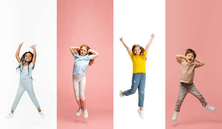 Art collage made of portraits of little and happy kids isolated on multicolored studio background. Human emotions, facial expression conceptの写真素材