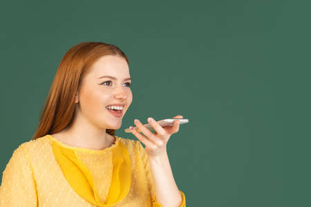 Caucasian womans portrait isolated over green studio background with copyspace for ad. Concept of...