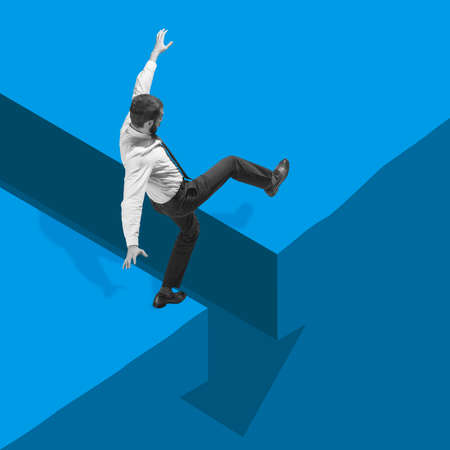 Business concept. Young manager, finance analyst or clerk in office suit isolated on blue...