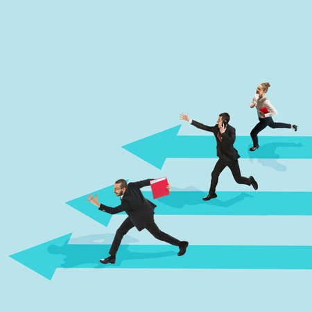 Business concept. Young people, office workers or clerks in office suit isolated on blue background. Collage, illustrationの写真素材