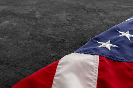 Close-up American national flag isolated over grey background. Memorial Day, Labour Day,...