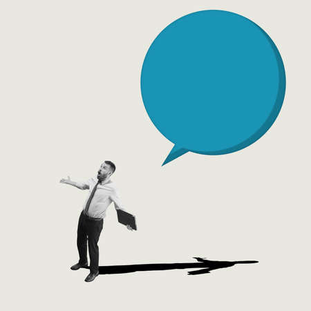 Surprised worker. Young astonished man, businessman, finance analyst or clerk in business clothes isolated on abstract background.の写真素材