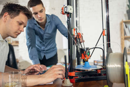 New generation of 3D Printing Machine printing a piece of plastic. For use in small spaces, Office or Private useの写真素材