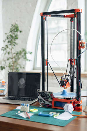 New generation of 3D Printing Machine printing a piece of plastic. For use in small spaces, Office or Private useの写真素材