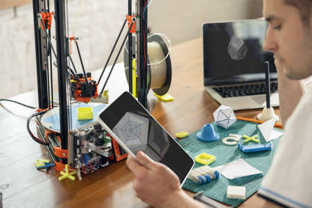 New generation of 3D Printing Machine printing a piece of plastic. For use in small spaces, Office...