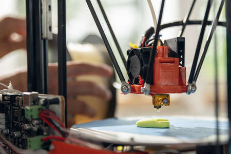 New generation of 3D Printing Machine printing a piece of plastic. For use in small spaces, Office...