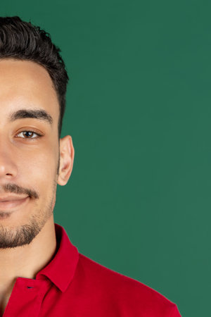 Cropped portrait of young man isolated over studio background with copyspaceの写真素材