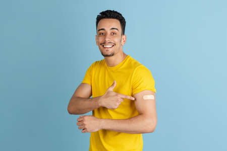 Caucasian mans portrait isolated over blue studio background with copyspace