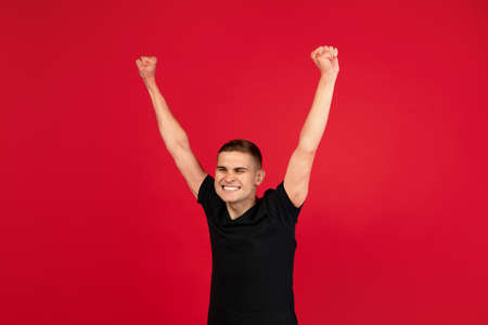 Caucasian mans portrait isolated over red studio background with copyspace for ad. Concept of human...