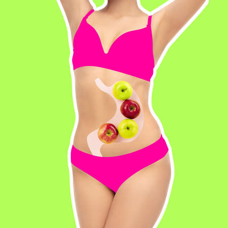 Slender female body isolated over light green neon back ground. Inspiration, idea, trendy urban magazine style. Contemporary art collageの写真素材