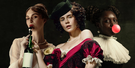 Medieval women as a historical persons in vintage clothing on dark background. Concept of comparison...