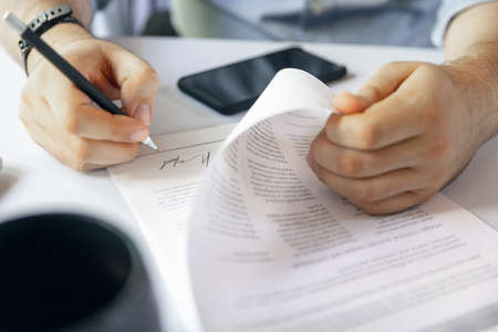 Close up of female hands signing business contract. Concept of female business, online education,...