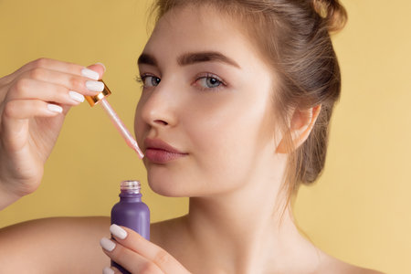 Portrait of young female fashion model isolated on pastel color studio background. Beautiful caucasian woman with well-kept skin.の写真素材