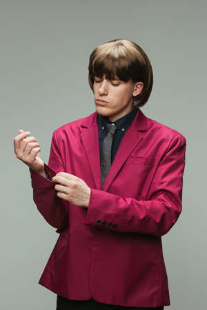 Caucasian mans portrait in retro style, fashion of 70s, 80s years isolated on gray studio background...