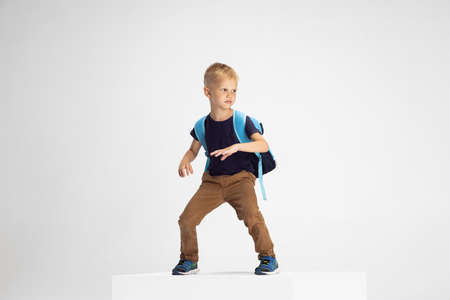 Portrait of cute Caucasian preschool boy isolated on white studio background. Copyspace for ad. Childhood, education, emotion conceptの写真素材