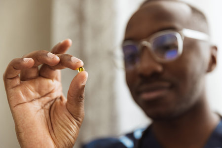 Close-up portrait of african young doctor, therapeutic or medical advisor at work, idoors . Concept of healthcare, care, medicine and professional occupationの写真素材