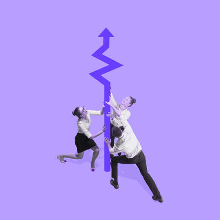 Male and female businessmen shaking a huge graph arrow on purple background. Concept of earning,...