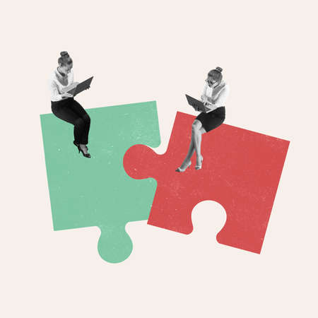 Teamwork. Young woman, businessman, finance analyst or clerk in business clothes isolated on light background. Green and red pieces of puzzleの写真素材