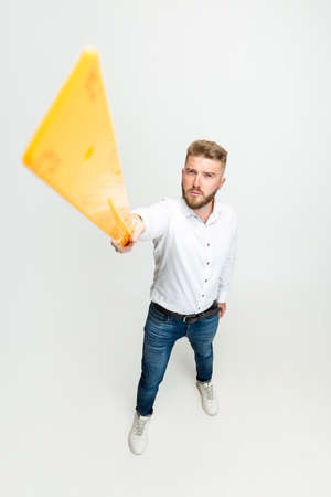 High angle view of funny bearded man, builder, designer or architect with professional equipment isolated on white studio background.の写真素材