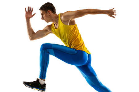 Portrait of professional male athlete, runner training isolated on white studio background....