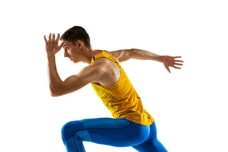 Profile view of Caucasian professional male athlete, runner training isolated on white studio...