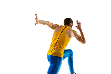 Caucasian professional male athlete, runner training isolated on white studio background. Muscular,...