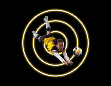 Young female volleyball player in action on black background with luminescent circles. Abstract...