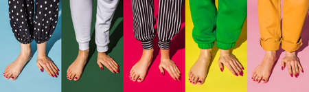 Contemporary art collage. Mix of hands and lega standing together isolated over bright background. Trendy colors, magazine style.の写真素材