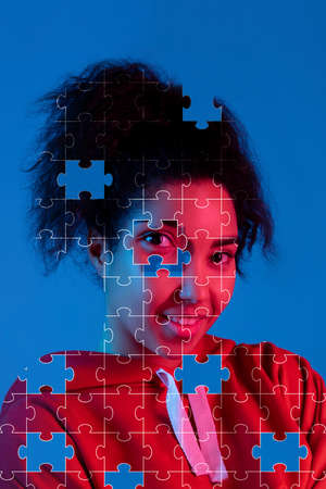 Conceptual image of young African girls made of missing pieces of puzzle, modern art collage....