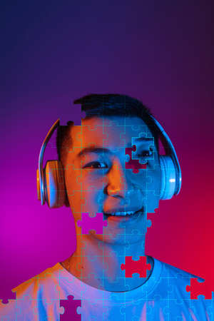 Artwork. Portrait of young man made of missing pieces of puzzle, modern art collage. Concept of...