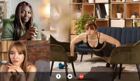 Young multiethnic people watching together online fitness trainings, sport tv programme using video...