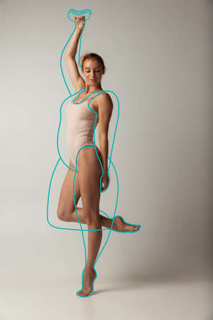 Portrait of young beautiful slim woman in lingerie isolated over gray background. Line art. Modern artworkの写真素材