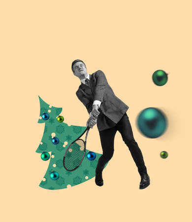 Business man palying tennis at corporate christmas party. Contemporary art collage. Holiday, winter, wishes, New Year and Christmas 2022 concept.の写真素材