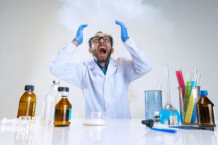 Portrait of young scientist, chemist or doctor conducts chemical research at pharmaceutical lab. Concept of chemistry, medicine.の写真素材