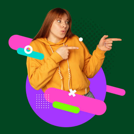 Happy young womans portrait isolated over dark green background with abstract neon lines. Bright artworkの写真素材