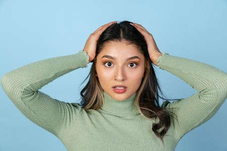 Close-up portrait of young beuatiful girl, student in casual style clothes looking at camera...