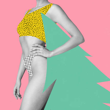 Contemporary art collage. Composition with young woman in swimsuit holding Christmas tree. New Year and Christmas 2022 concept.の写真素材