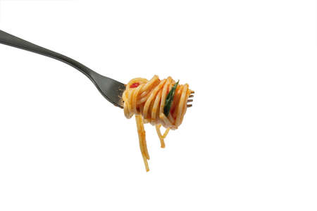 Italian food. Fork with delicious pasta with sauce and basil leaf isolated on white background. Concept of worldwide national cuisinesの写真素材