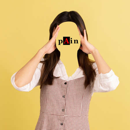 Contemporary artwork. Conceptual portrait of faceless woman with word pain instead face. Human...