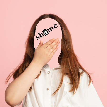 Conceptual portrait of little faceless girl with word shame instead face. Human emotions,...