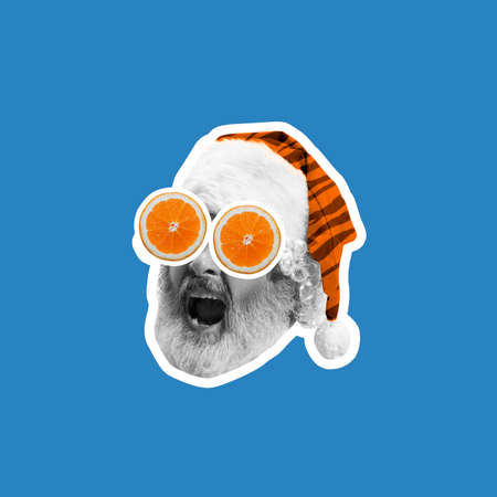 Contemporary art collage. Close-up Santa Claus face in glasses shouting greetings with 2022 Happy New Year and Merry Christmas.の写真素材