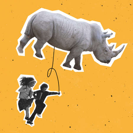 Contemporary art collage, modern design. Magazine style. Minimalism. Two little kids walking with huge rhinoceros isolated on yellow backgroundの写真素材