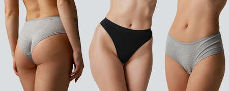 Cropped images of sportive bodies, bellies and bottocks of young women in underwear isolated on pink...
