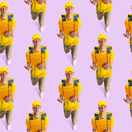 Pattern made of portraits of delivery man in yellow uniform holding boxes with pizza isolated on light background.の写真素材