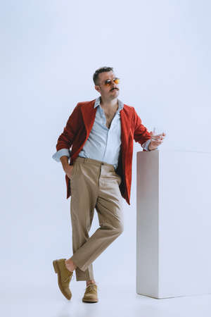 Portrait of young man, hipster or dandy, dude dressed in 50s, 60s style isolated on white background. retro vintage styleの写真素材