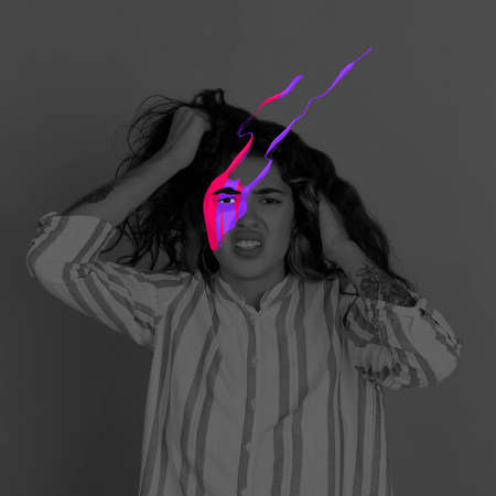 Conceptual image with black and white portrait of young girl with bright colored spots on her face. Concept of mental health, dreams, imaginationの写真素材